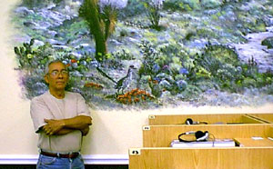 Jose Luis Hernandez standing before is art.